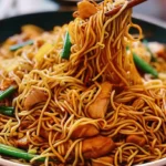 Plate of Chicken Chow Mein with noodles, chicken, and vegetables.