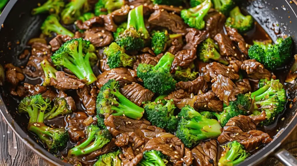 Steak and broccoli stir fry with beef slices and broccoli in a pan.