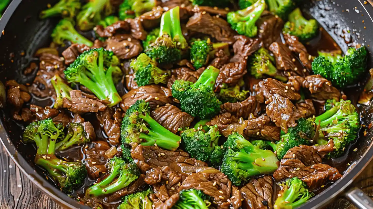 Steak and broccoli stir fry with beef slices and broccoli in a pan.
