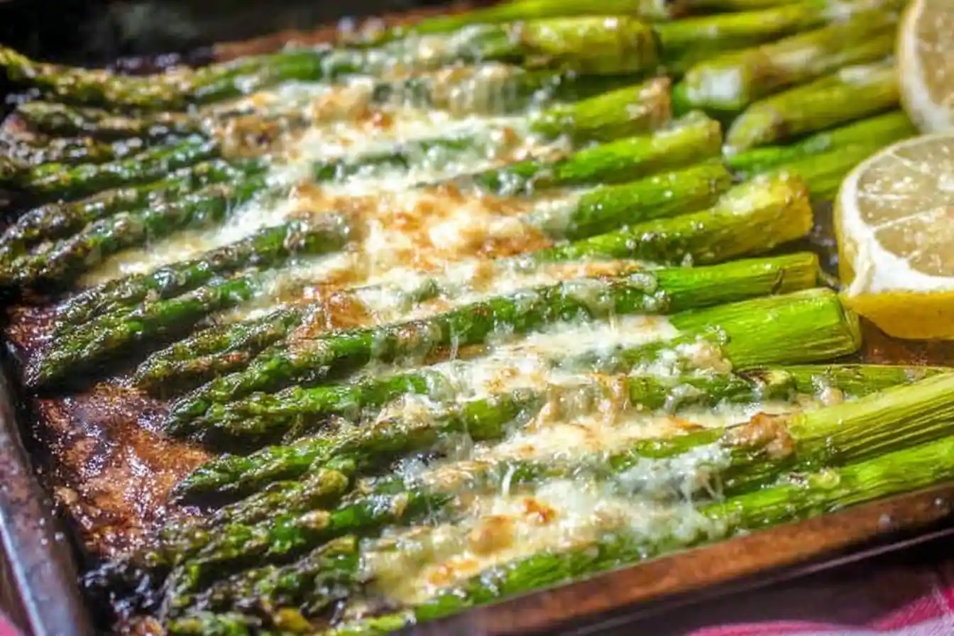 Pan of freshly made {{ $('Fetch Recipe Data').first().json["Main Keyword"] }} with melted cheese and lemon.