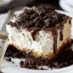 A slice of {{ $('Fetch Recipe Data').first().json["Main Keyword"] }} with cream and chocolate drizzle.