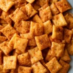 A close-up pile of golden, crispy {{ $('Fetch Recipe Data').first().json["Main Keyword"] }} seasoned with savory spices.