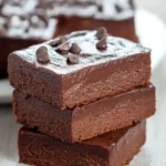 Close-up of three stacked {{ $('Fetch Recipe Data').first().json["Main Keyword"] }} topped with chips.