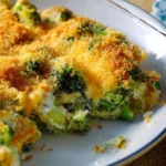 A baked {{ $('Fetch Recipe Data').first().json["Main Keyword"] }} topped with melted cheddar cheese and crispy breadcrumbs.