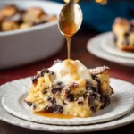 Pouring syrup over a warm slice of chocolate chip bread pudding topped with vanilla ice cream.