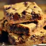 Delicious chocolate chip cookie bars displayed on a wooden table