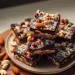 Delicious chocolate nut dessert bars stacked on a plate
