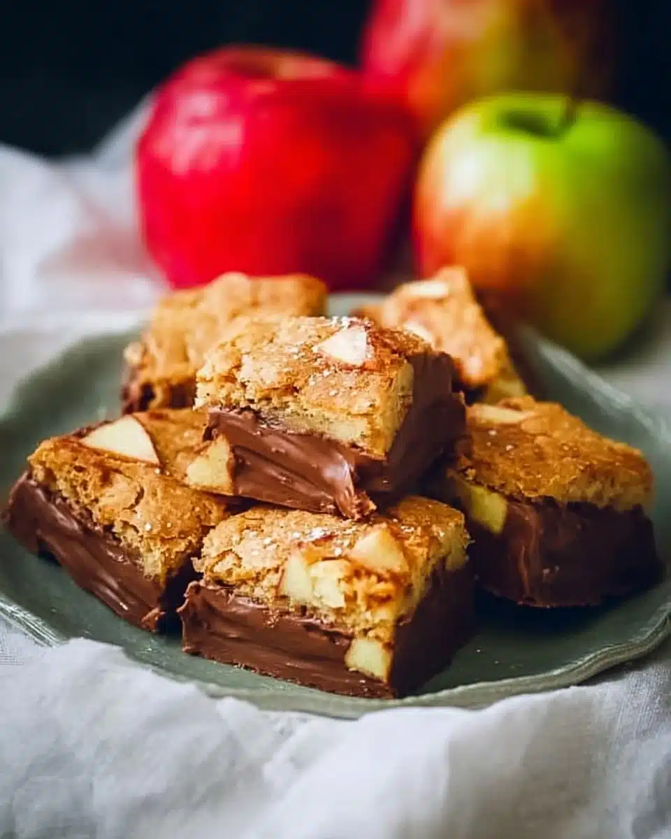 Freshly baked Cinnamon Apple Blondies with a sprinkle of cinnamon on top.