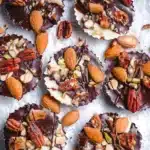 Crunchy chocolate mixed nut cups with nuts and chocolate drizzle