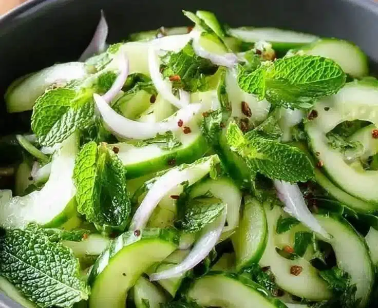 Cucumber Mint Salad with fresh cucumbers and mint leaves in a bowl