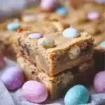 Plate of colorful Easter Blondies topped with pastel sprinkles