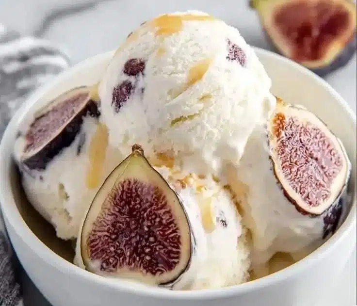 Delicious fig ricotta ice cream served in a bowl with fresh figs.