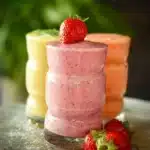 Variety of healthy smoothies in glasses with fruits and vegetables for a nutritious boost