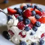 Delicious Red, White and Blue Cheesecake Salad with fresh berries and creamy cheesecake