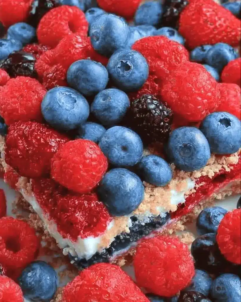 Red White and Blue Mixed Berry dessert with strawberries, blueberries, and whipped cream