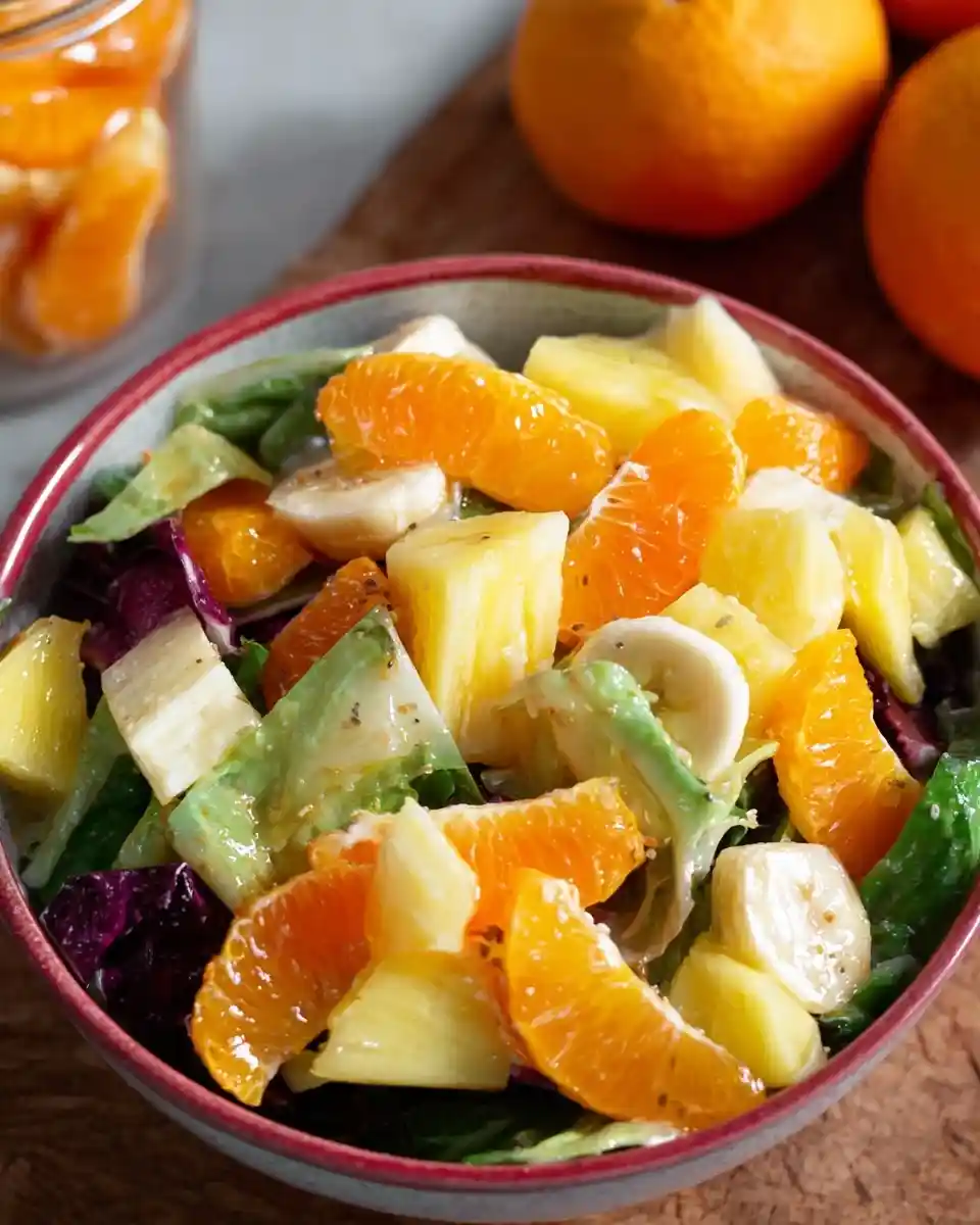 A colorful {{ $('Fetch Recipe Data').first().json["Main Keyword"] }} featuring pineapple, bananas, and mixed greens.