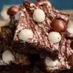 Delicious super fudgy brownies topped with chocolate chips and nuts